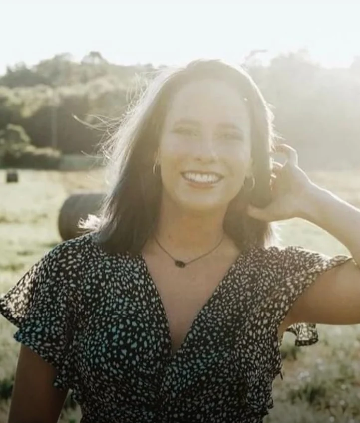 Grace Campbell, NeuroKinetic Therapy practitioner, smiling outdoors in natural light